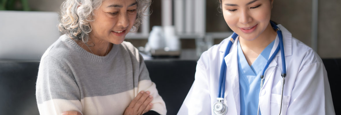 Asian female doctor examining a patient to assess the illness for proper treatment.